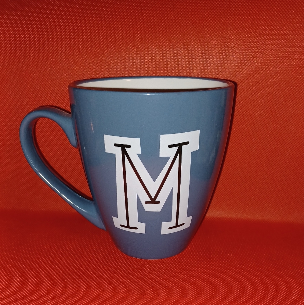 Blue initial M in black outlined in white mug (111224C)